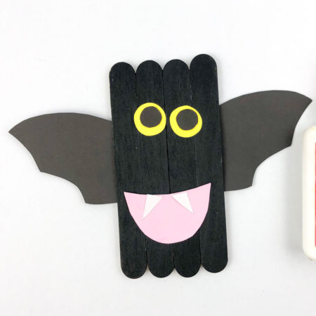 black bat made out of popsicle sticks and paper