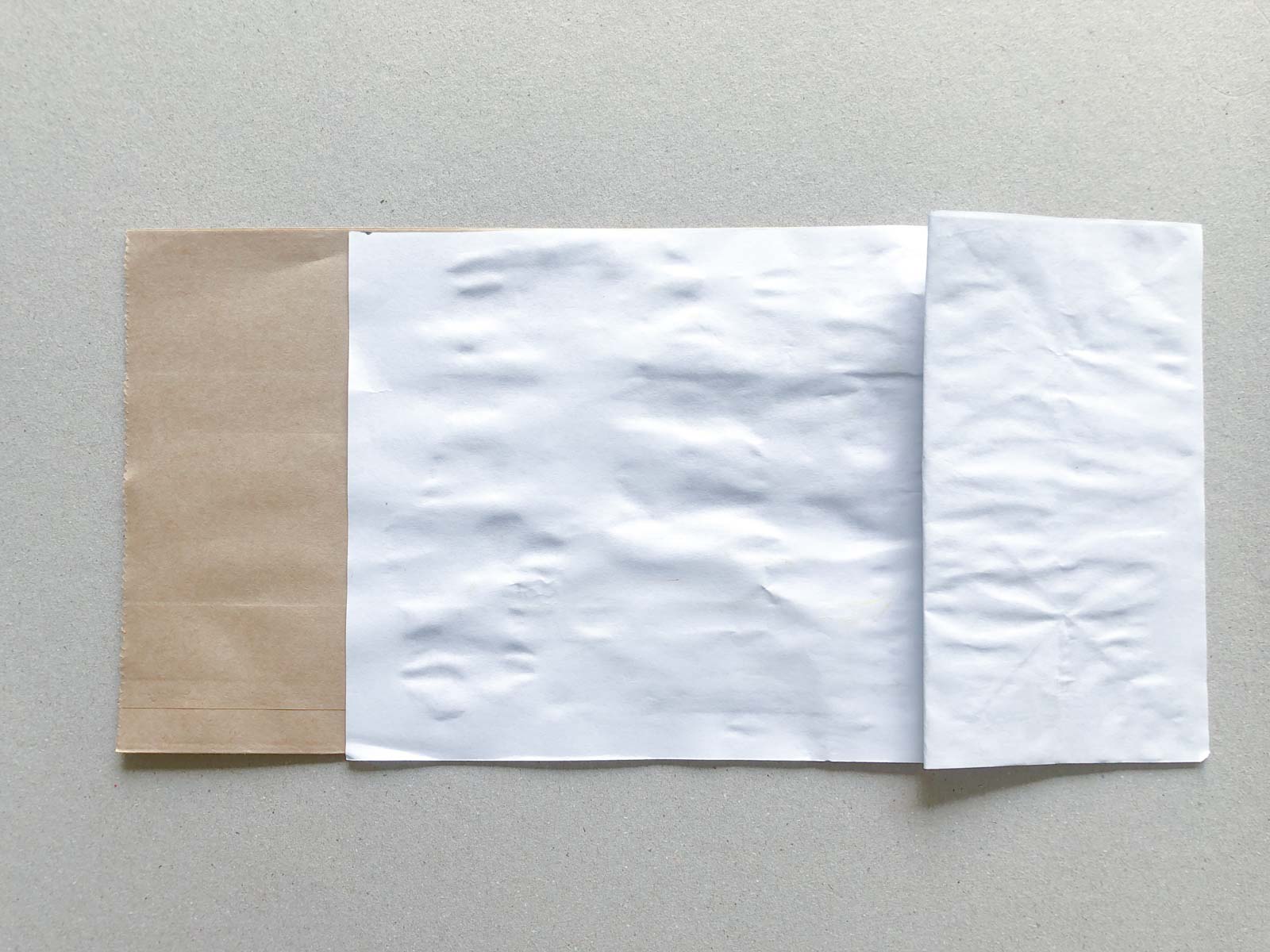 piece of white paper taped on a paper bag
