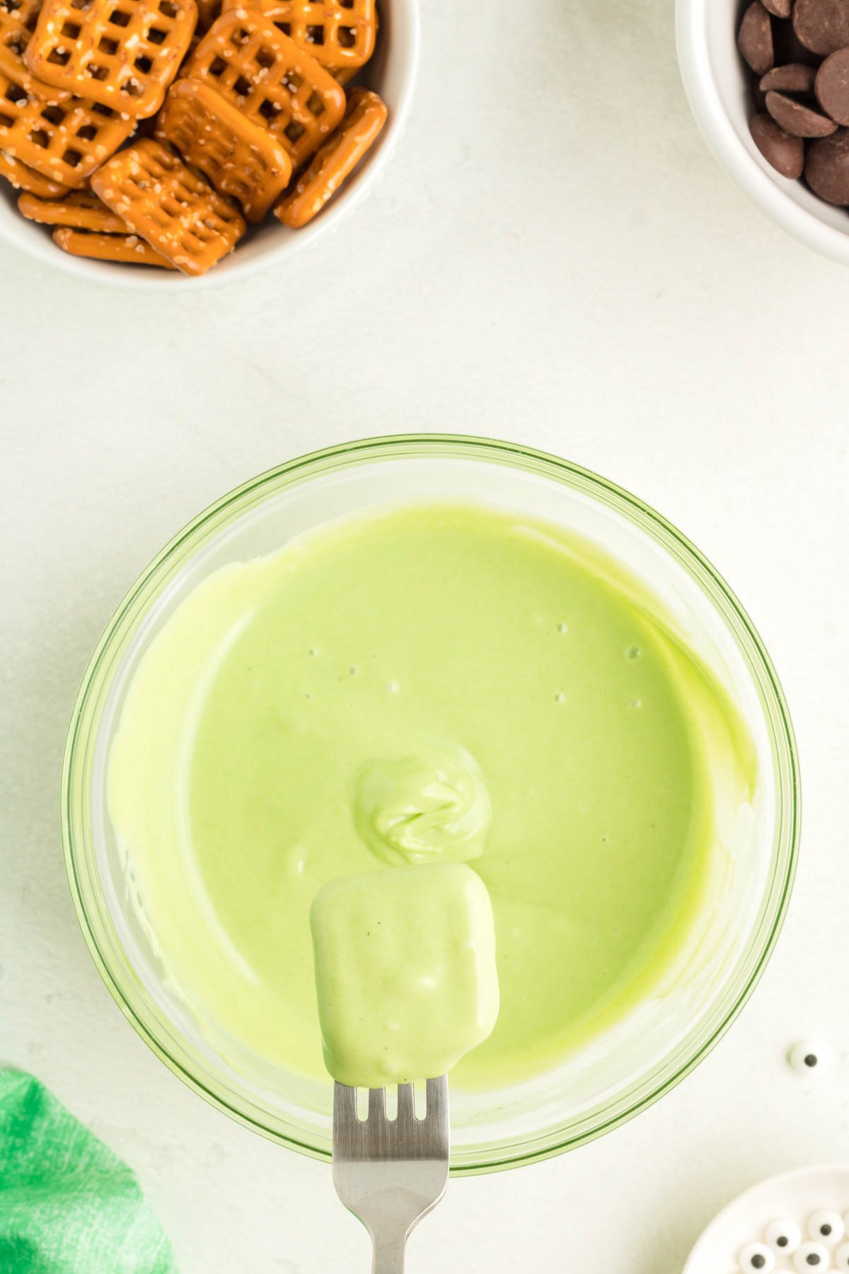 melted green candy melts in a glass bowl