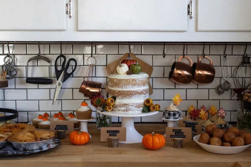 food table with various cakes and pies