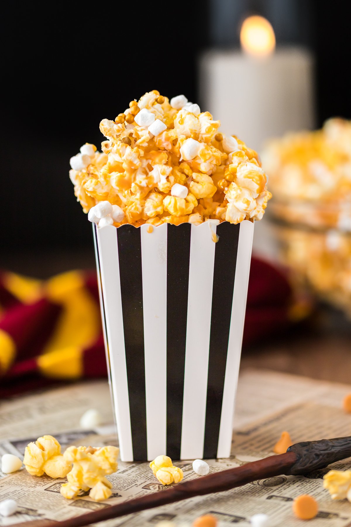 black popcorn container with butterbeer popcorn