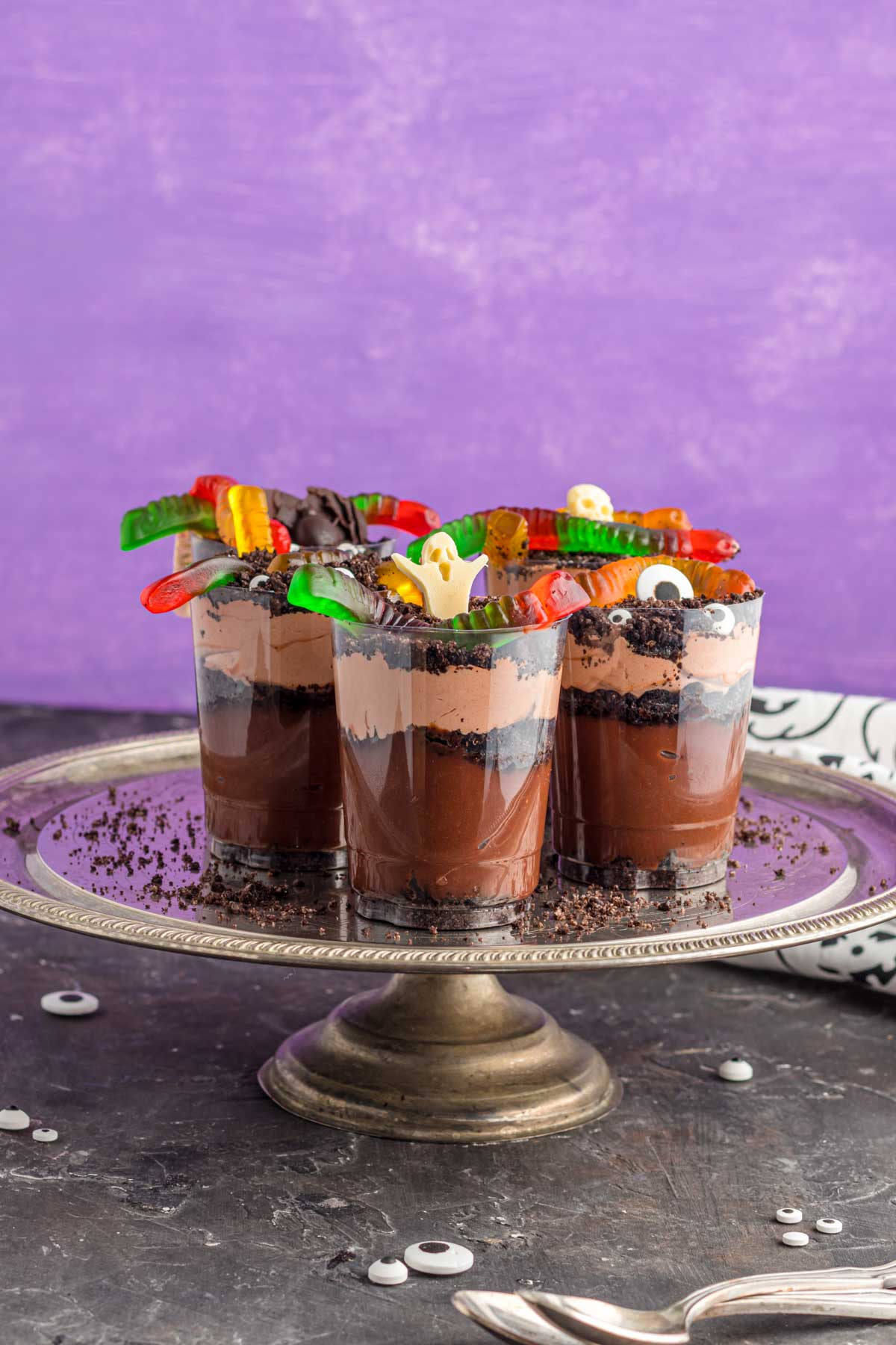 Halloween dirt cups on a metal cake stand