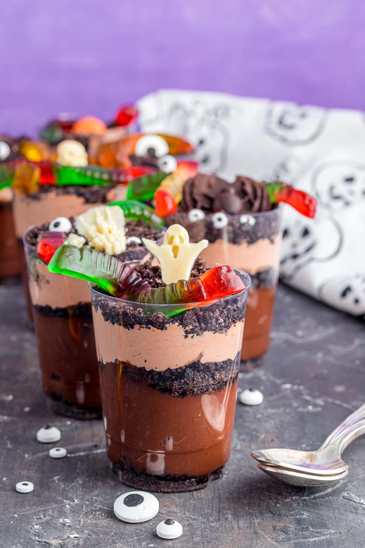 Halloween dirt cups with a purple background