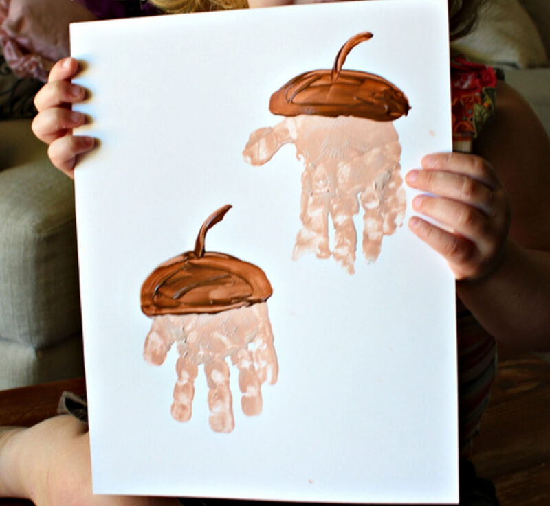 handprint painting with acorn tops