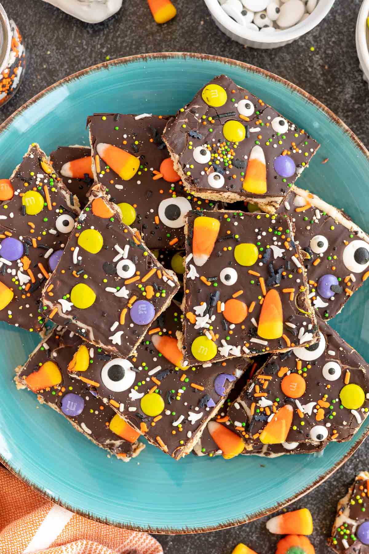 pieces of Halloween bark on a blue plate