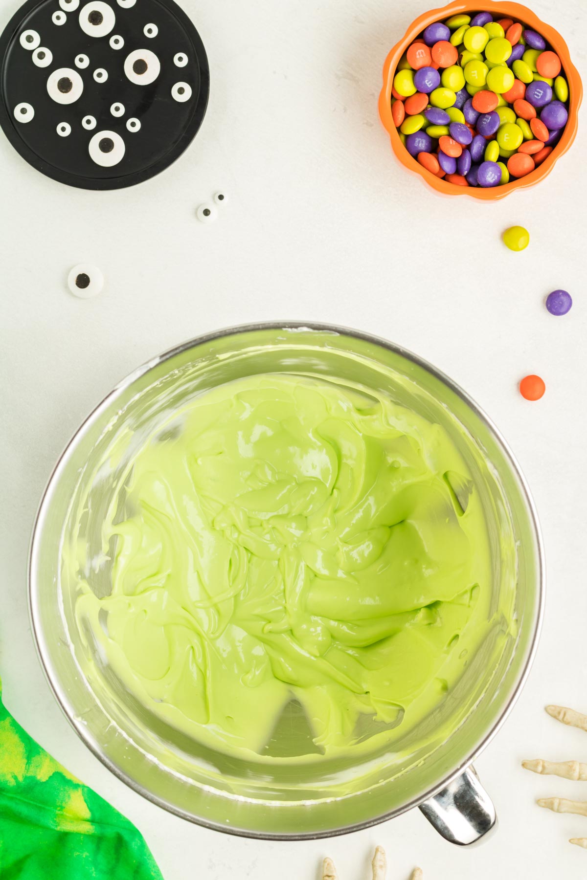 green cream cheese dip in a mixing bowl