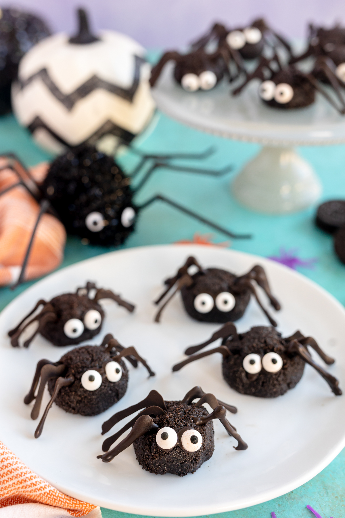 Oreo spider treats on a white plate