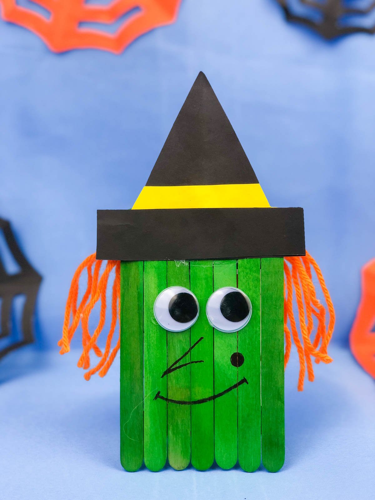 Popsicle stick witch with yarn hair