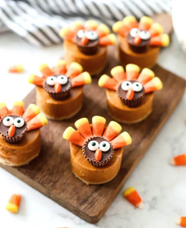 mini pumpkin pies with candy turkey feathers