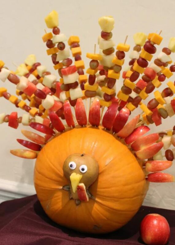 pumpkin with turkey face and fruit kabob feathers