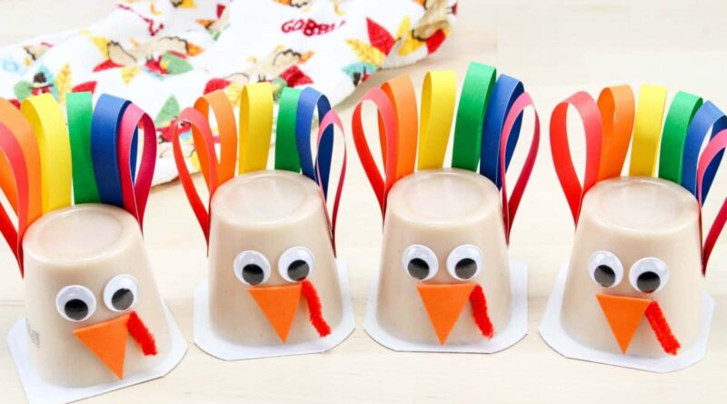 upside down pudding cups decorated with feather and turkey face