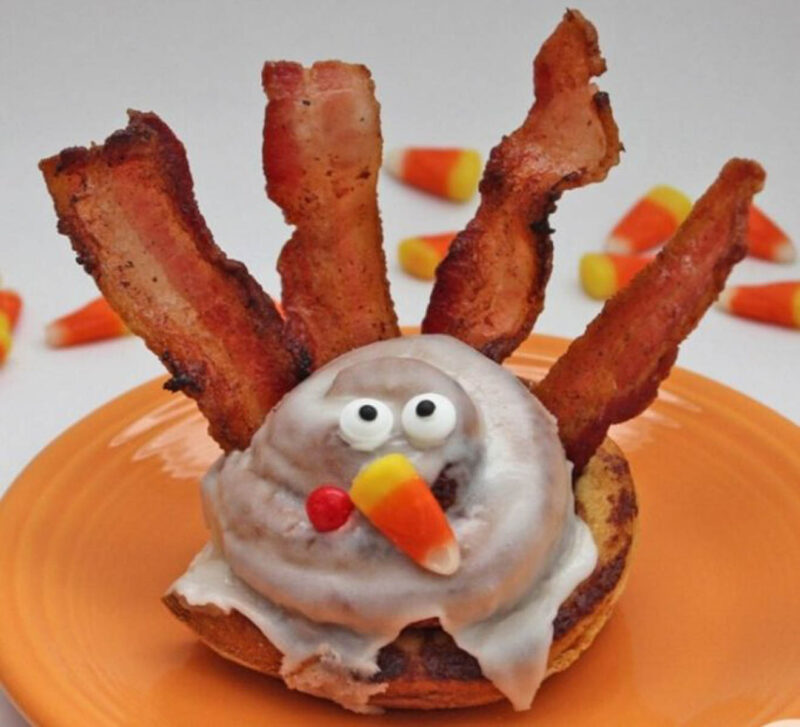 cinnamon roll with bacon feathers and turkey face