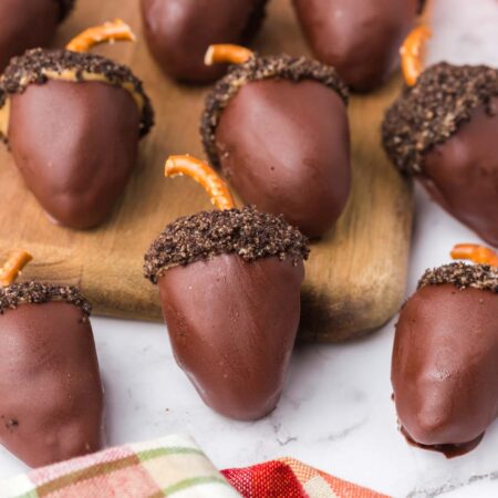 chocolate covered acorn Oreo balls on a plate