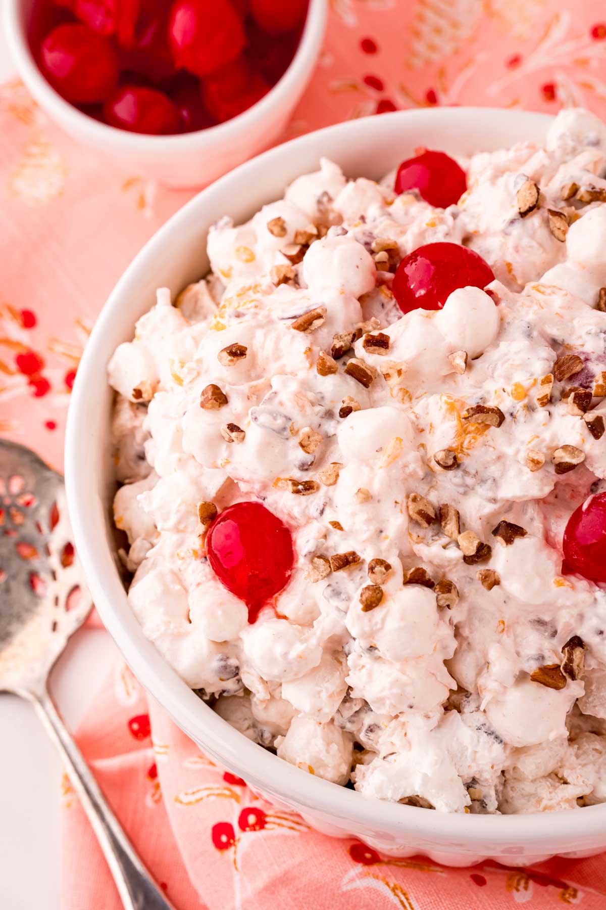 top down view of a white bowl with ambrosia salad