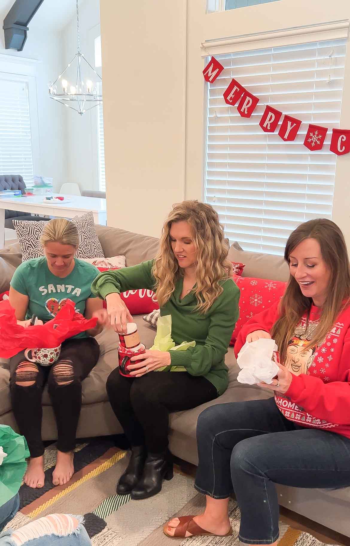 women opening Christmas mugs at a mug exchange