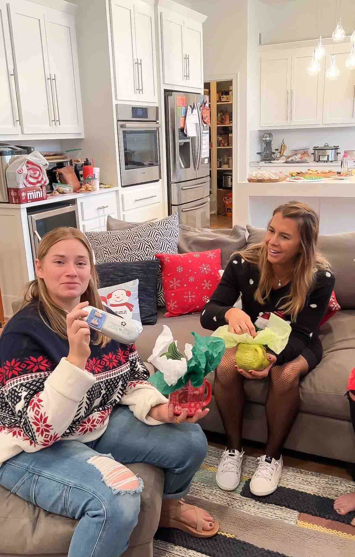 girl holding gifts from a holiday mug exchange