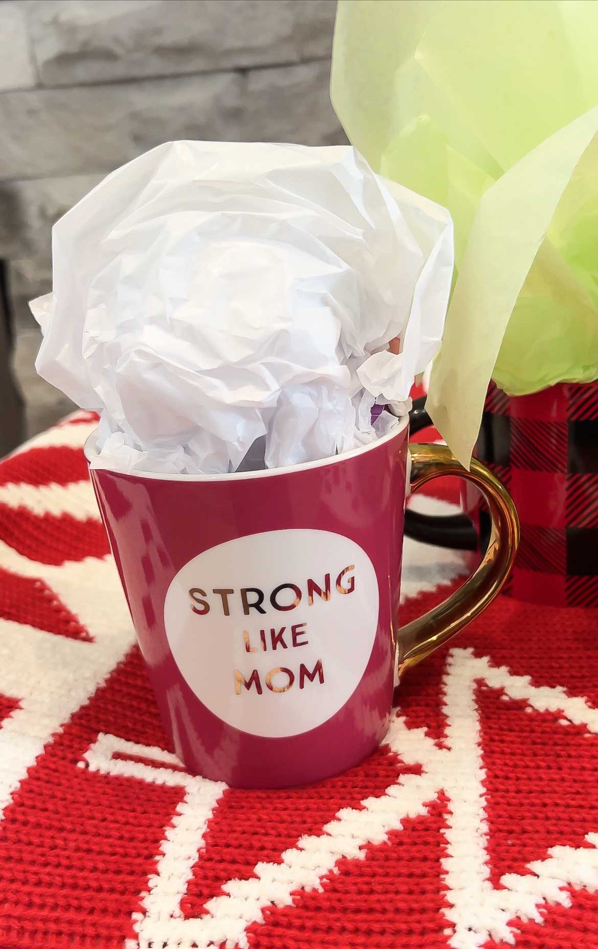 strong like mom mug filed with gifts