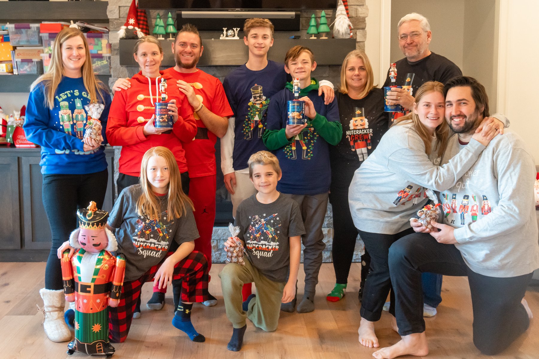 family group in nutcracker shirts posing for a picture