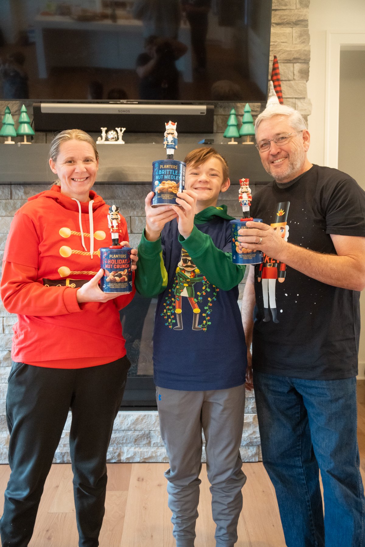 Family members holding nut trophies