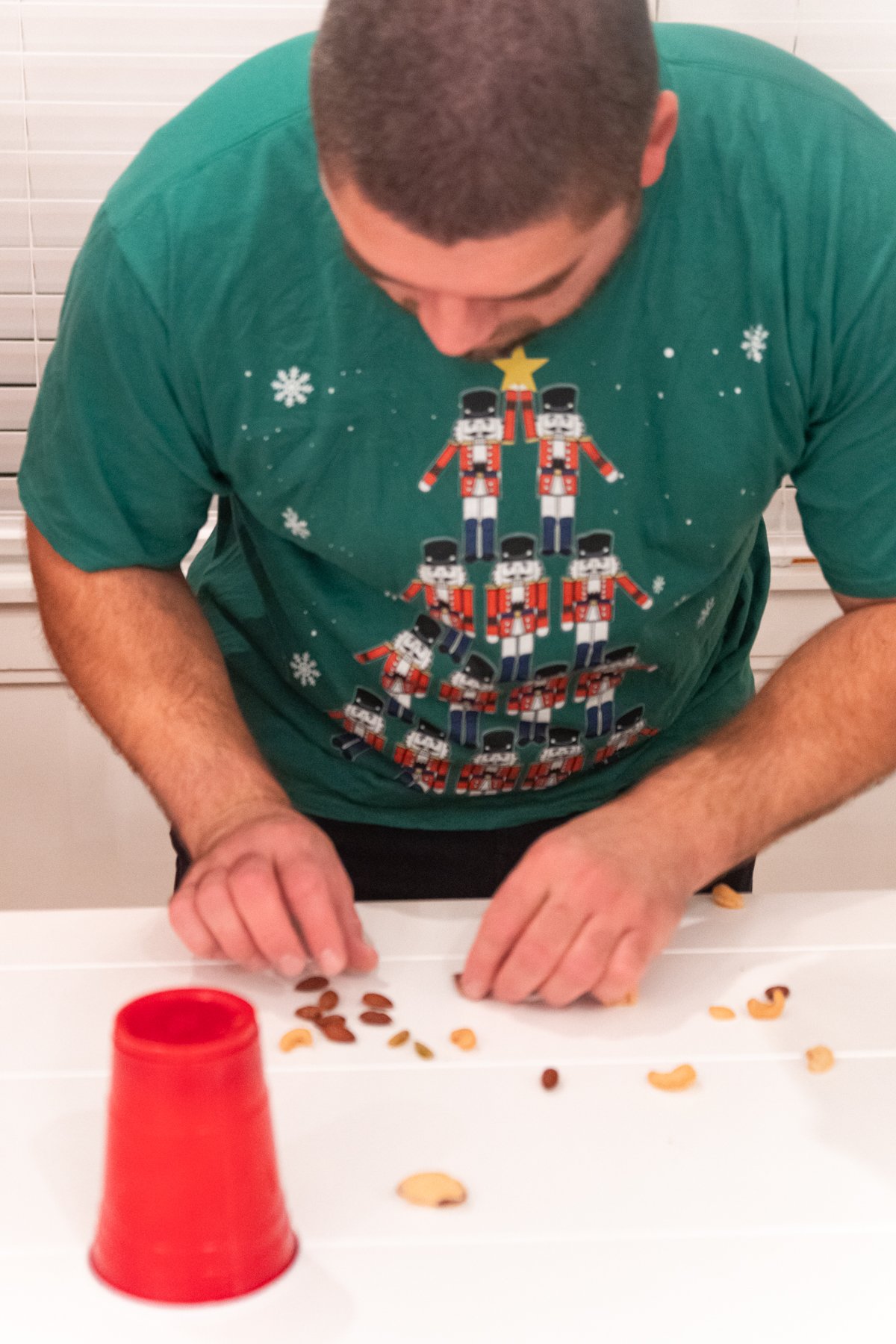 man trying to sort nuts