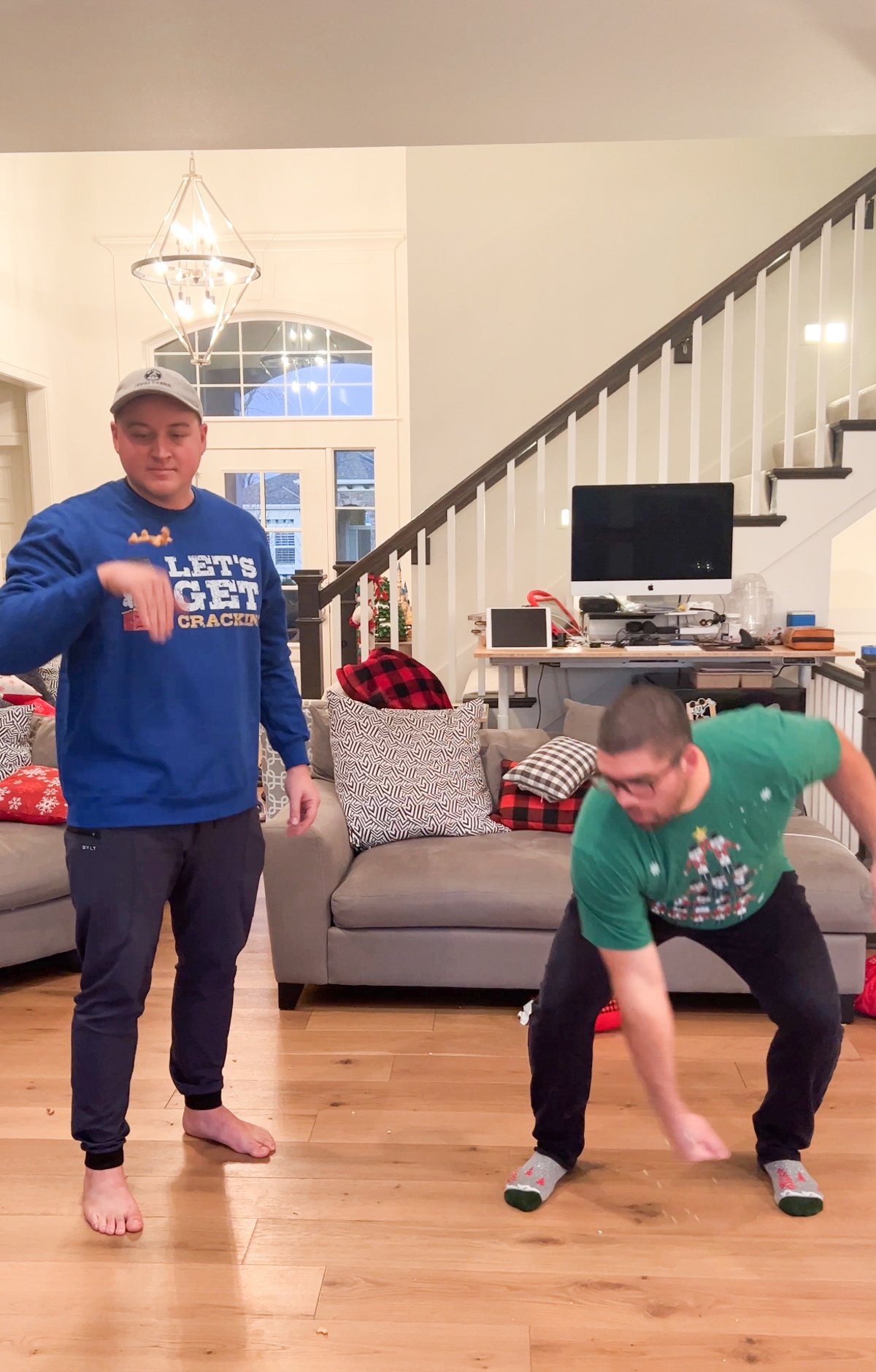 two men trying to catch cashews 