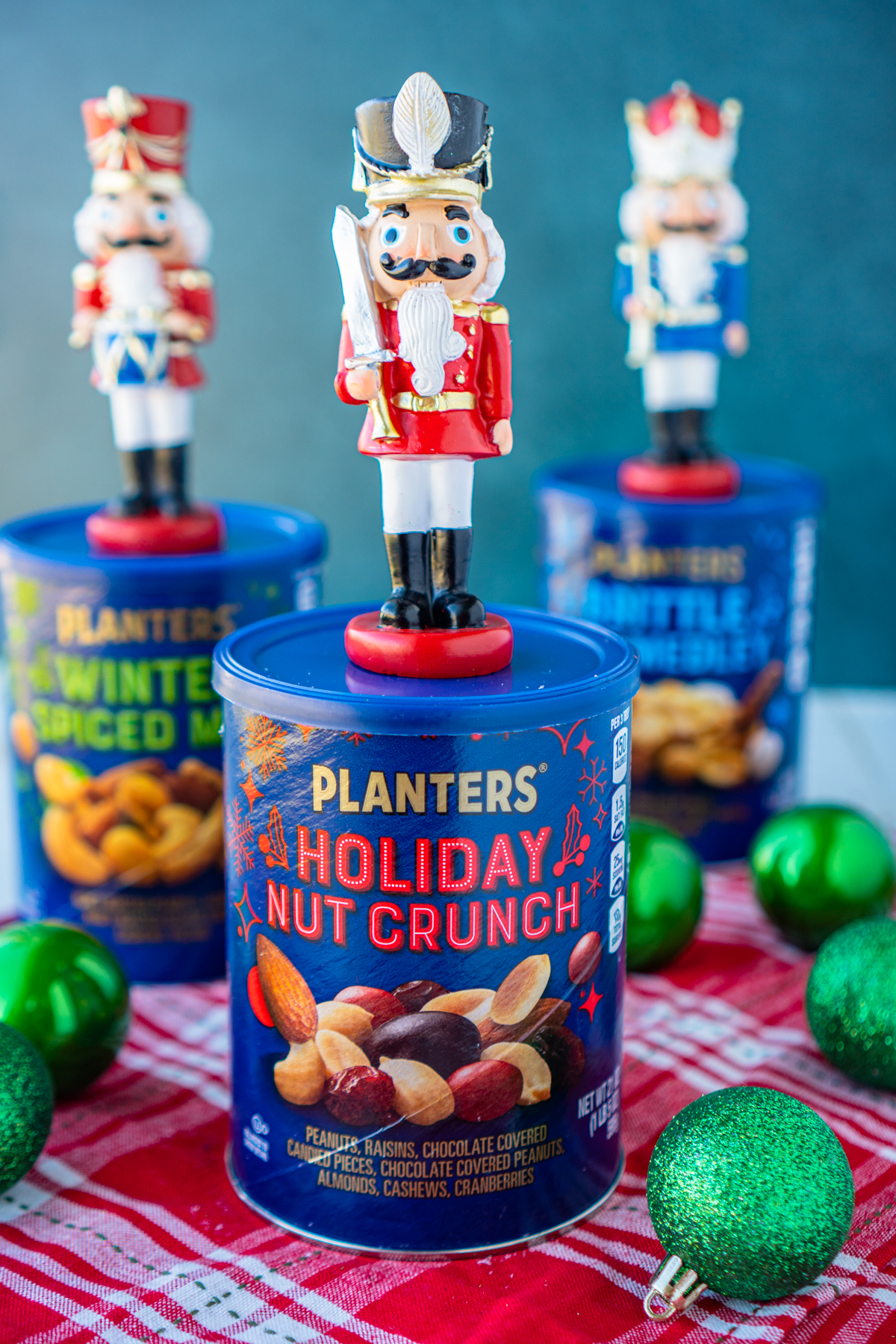 Containers of mixed nuts with nutcrackers on top