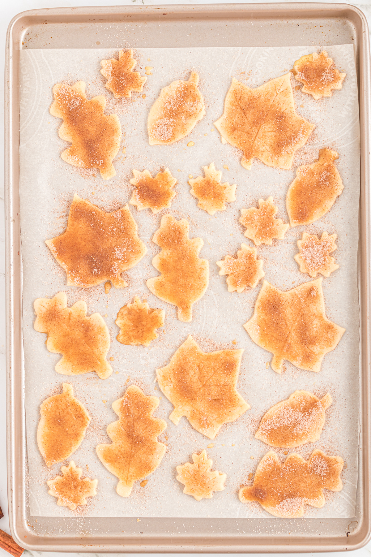 baking sheet with golden brown pie crust cookies
