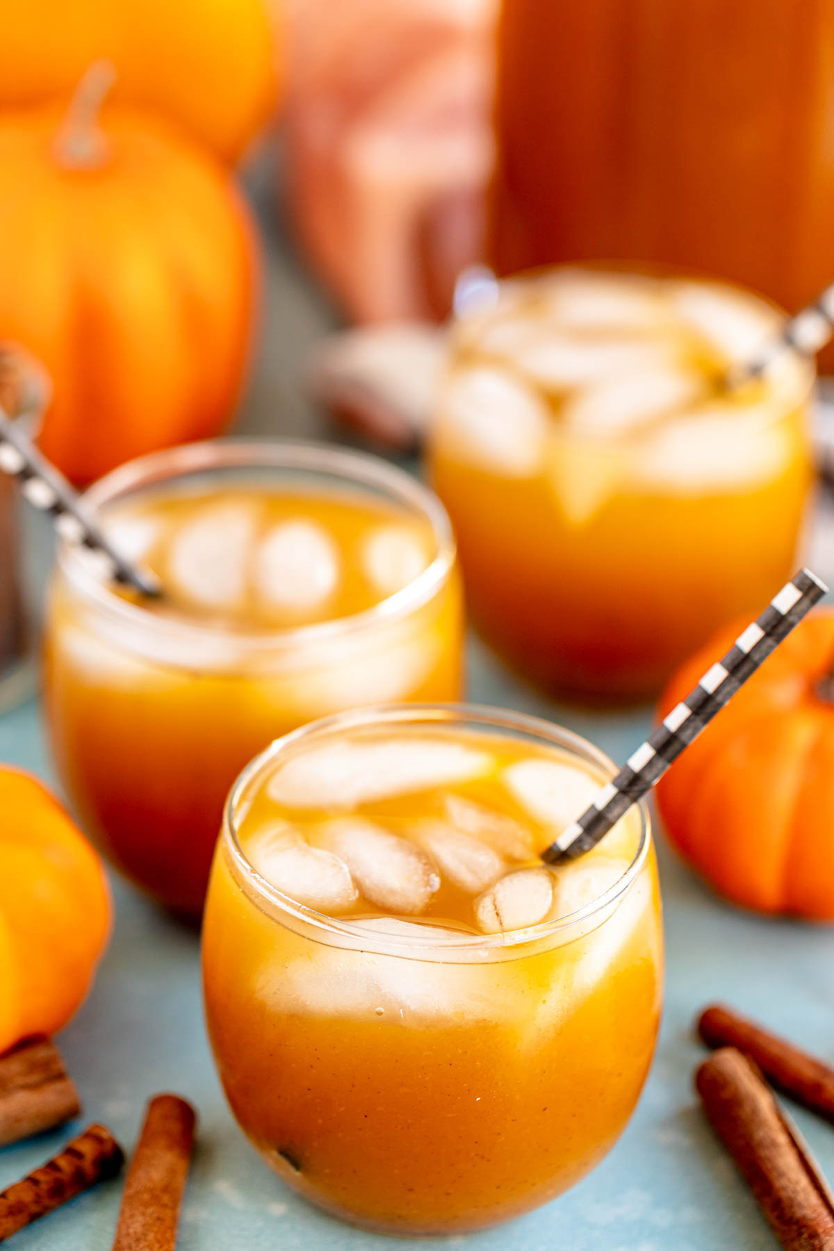 glasses of pumpkin juice with straws