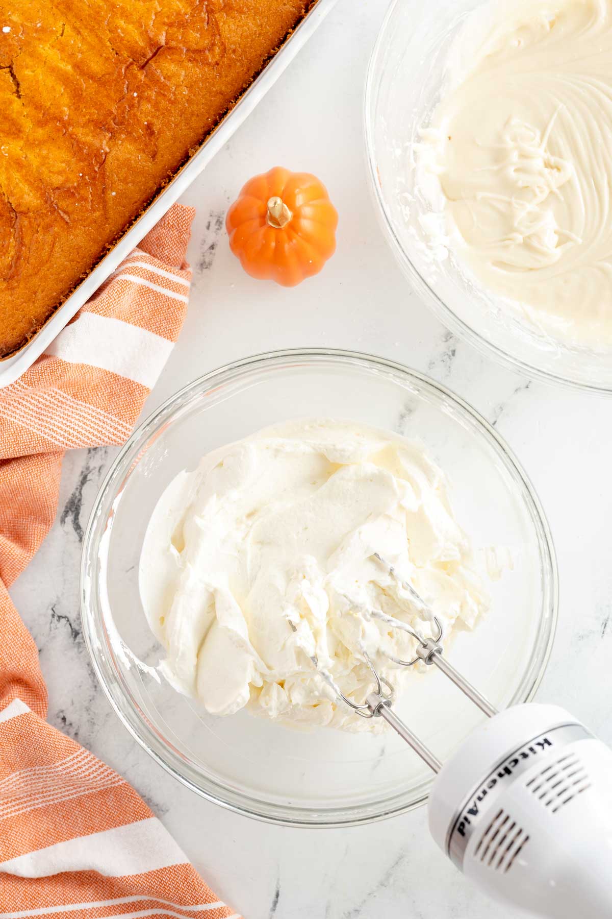 cream cheese frosting in a glass bowl