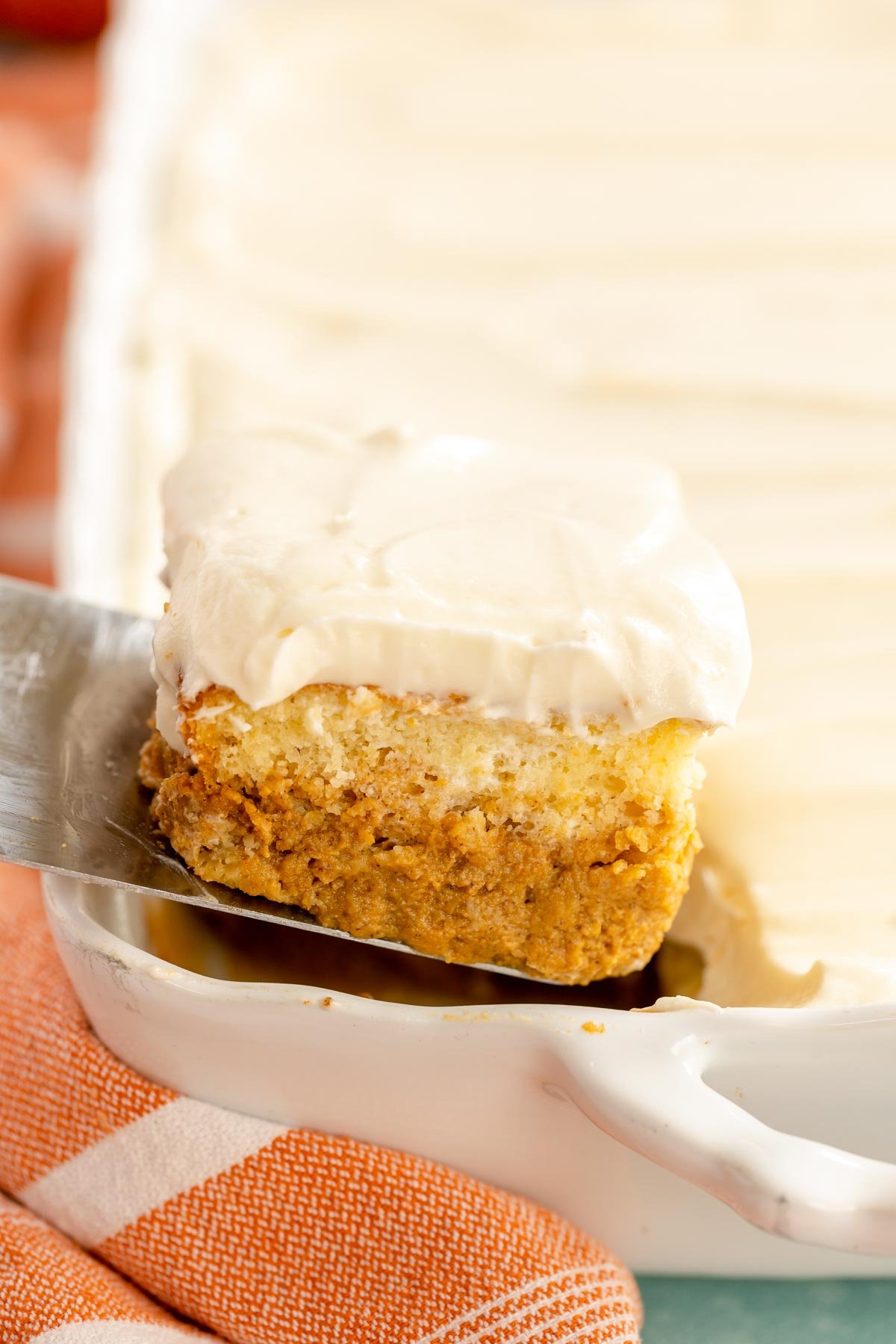 slice of pumpkin magic cake on a spatula