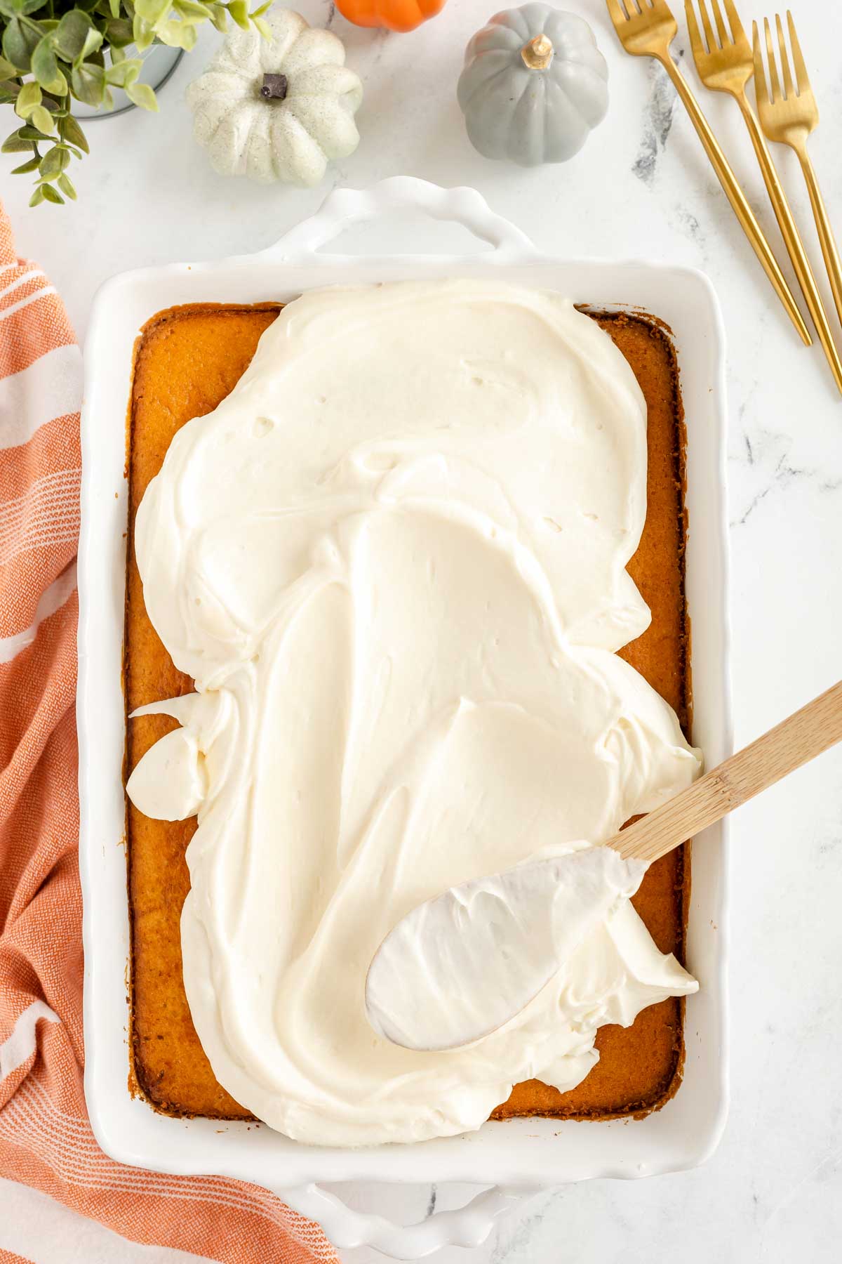 frosting pumpkin magic cake with cream cheese frosting