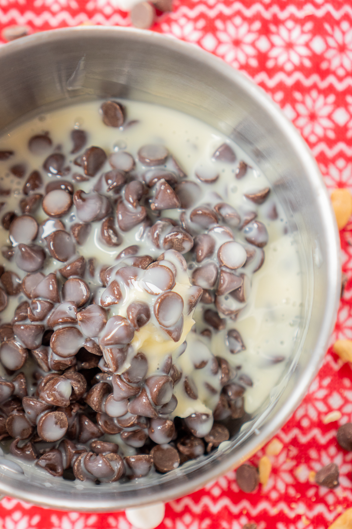 chocolate chips and sweetened condensed milk in a pan