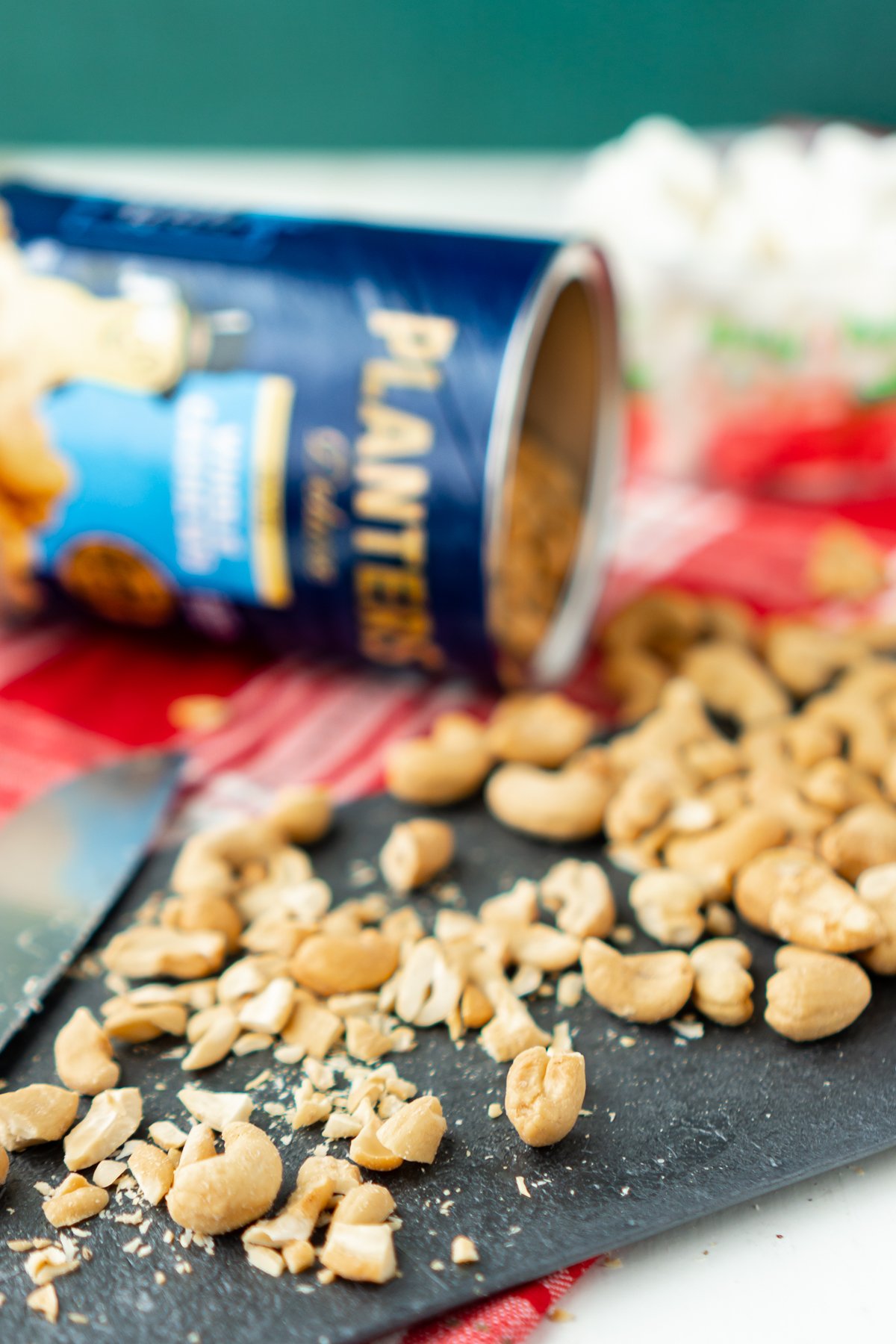 cutting board with chopped cashews