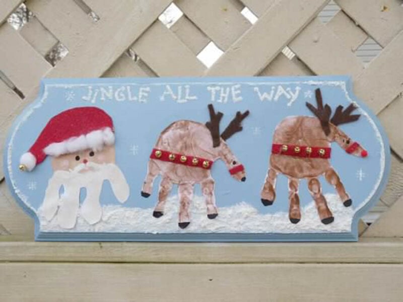 Santa and reindeer handprint on plaque