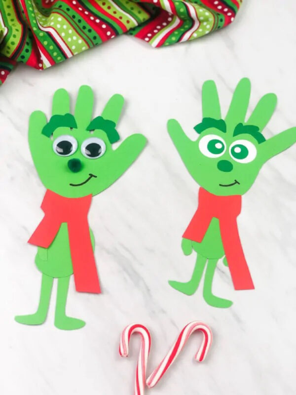 Green grinch characters made from handprint cutouts