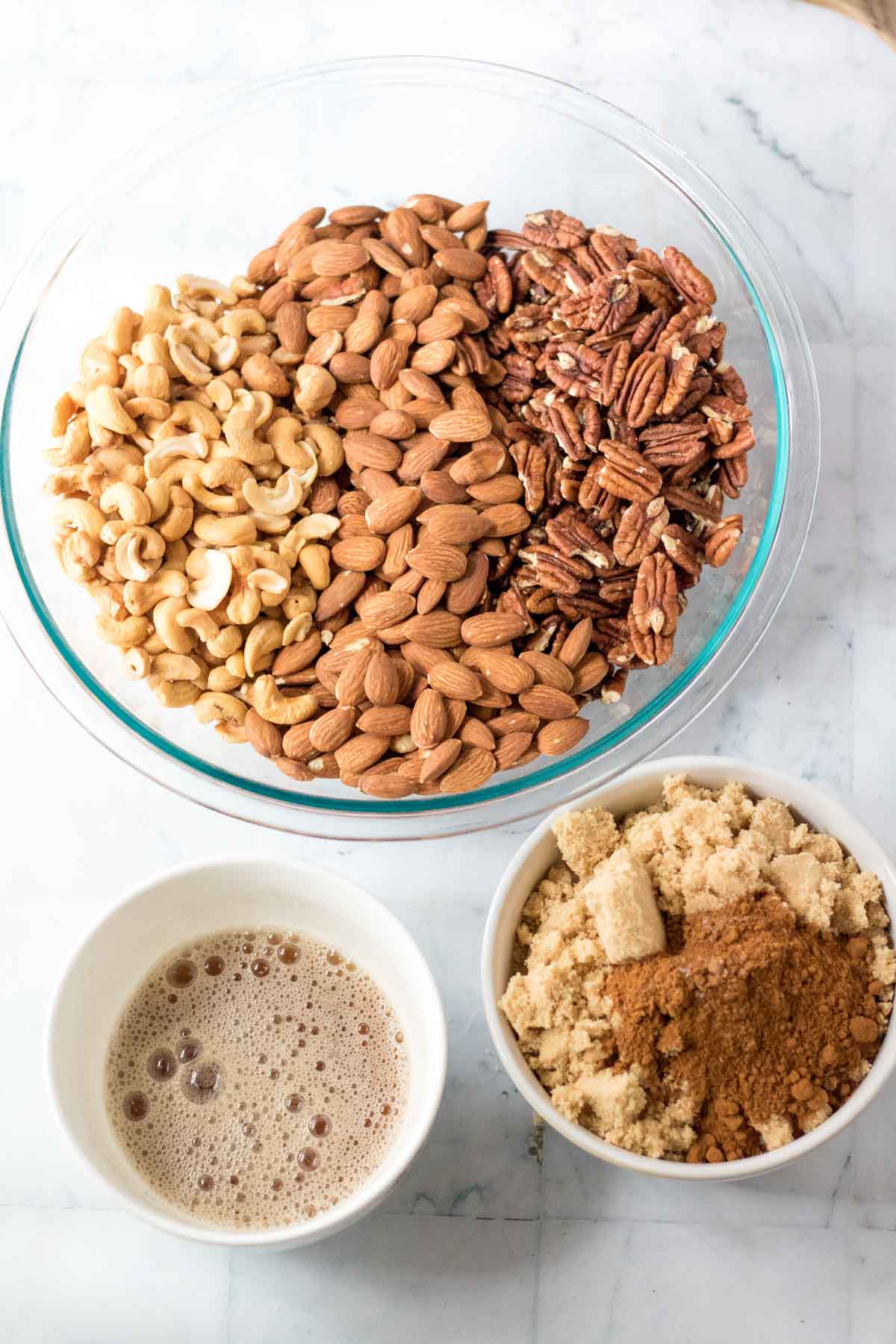 cinnamon sugar mixture next to a bowl of candied nuts