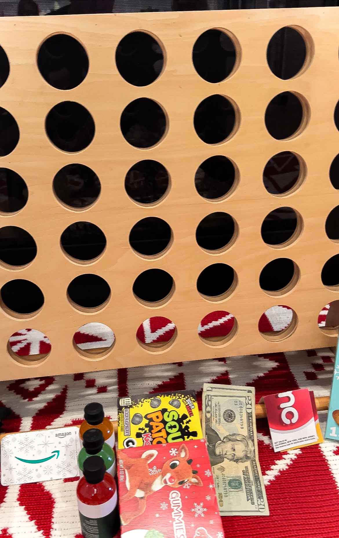 prizes underneath a connect four game