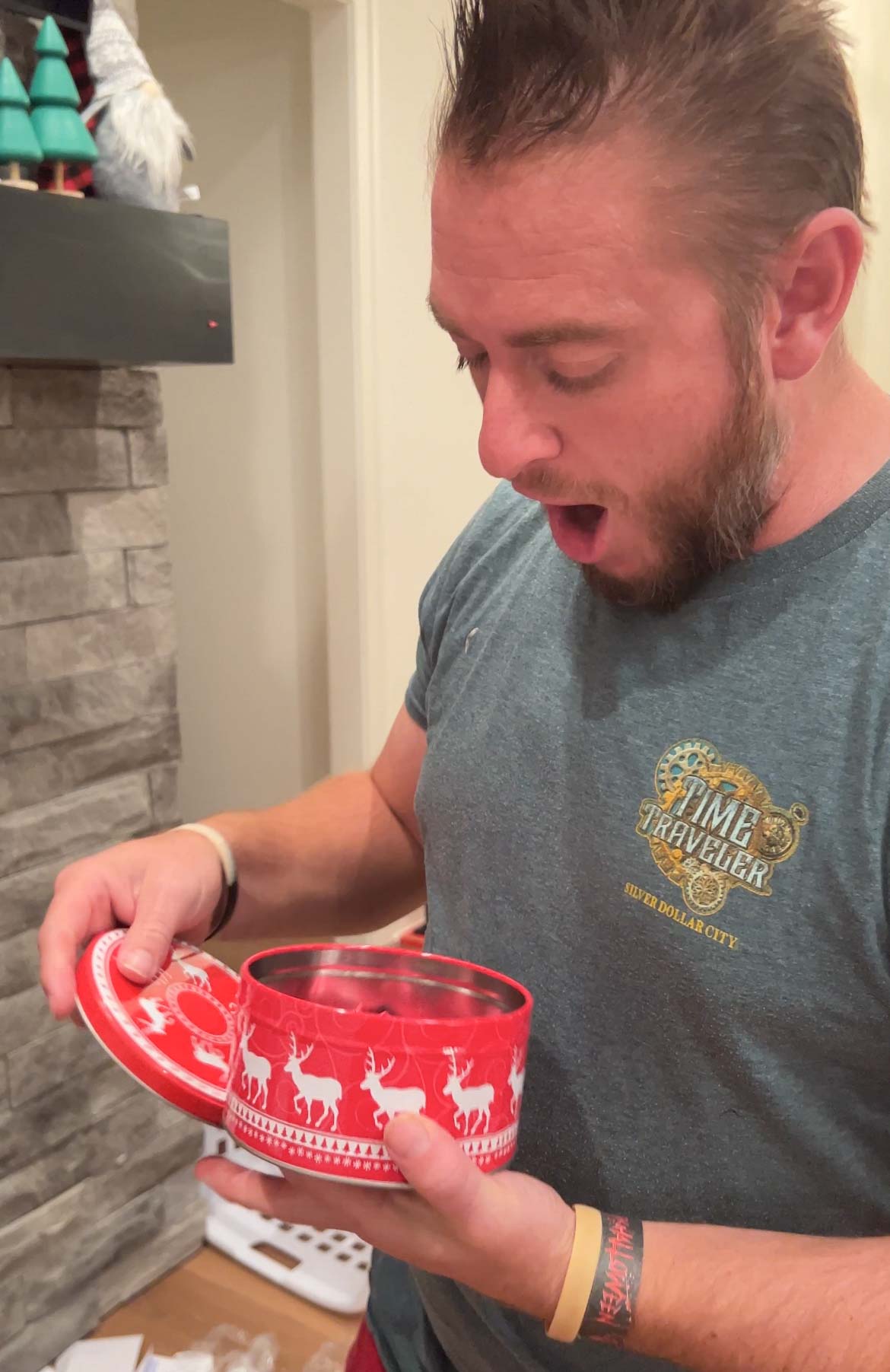 man opening a gift