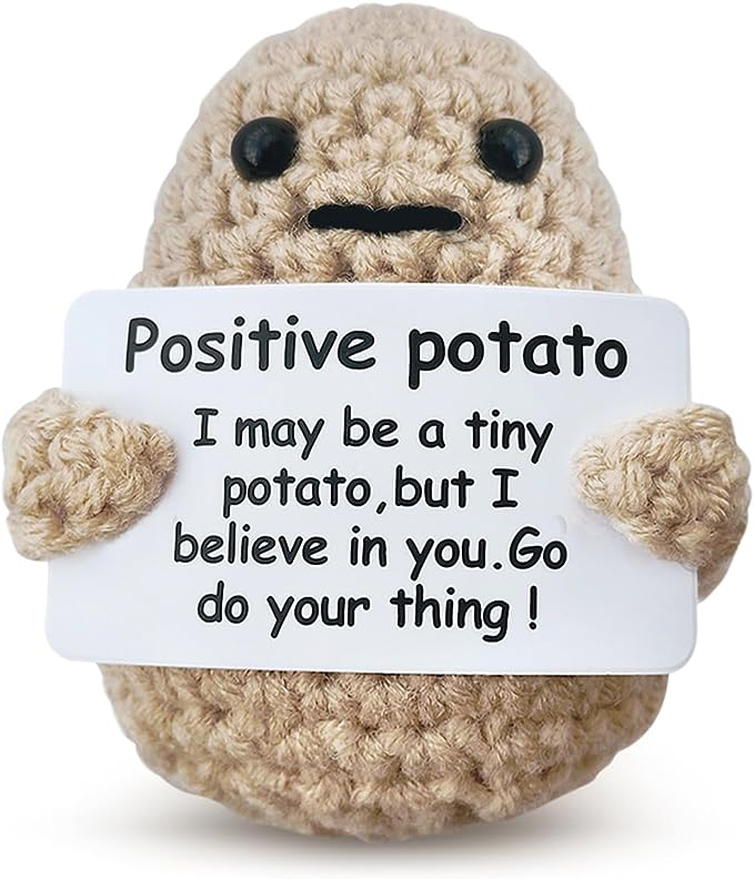 knit potato with positive phrase written on sign
