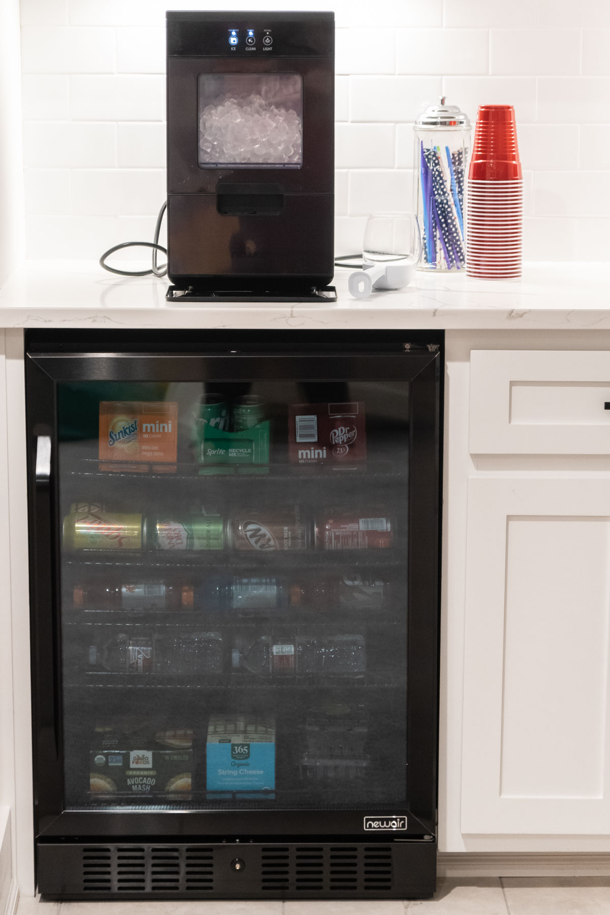 black stainless mini fridge and nugget ice maker