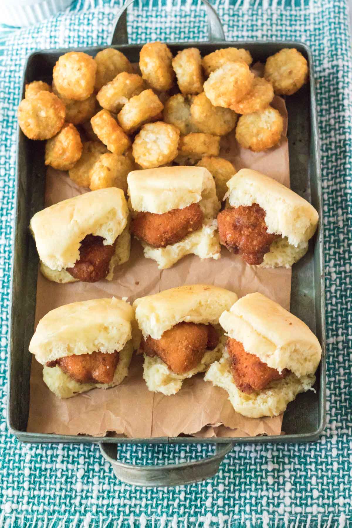 copycat chick fil a chicken minis and tater tots in a serving pan