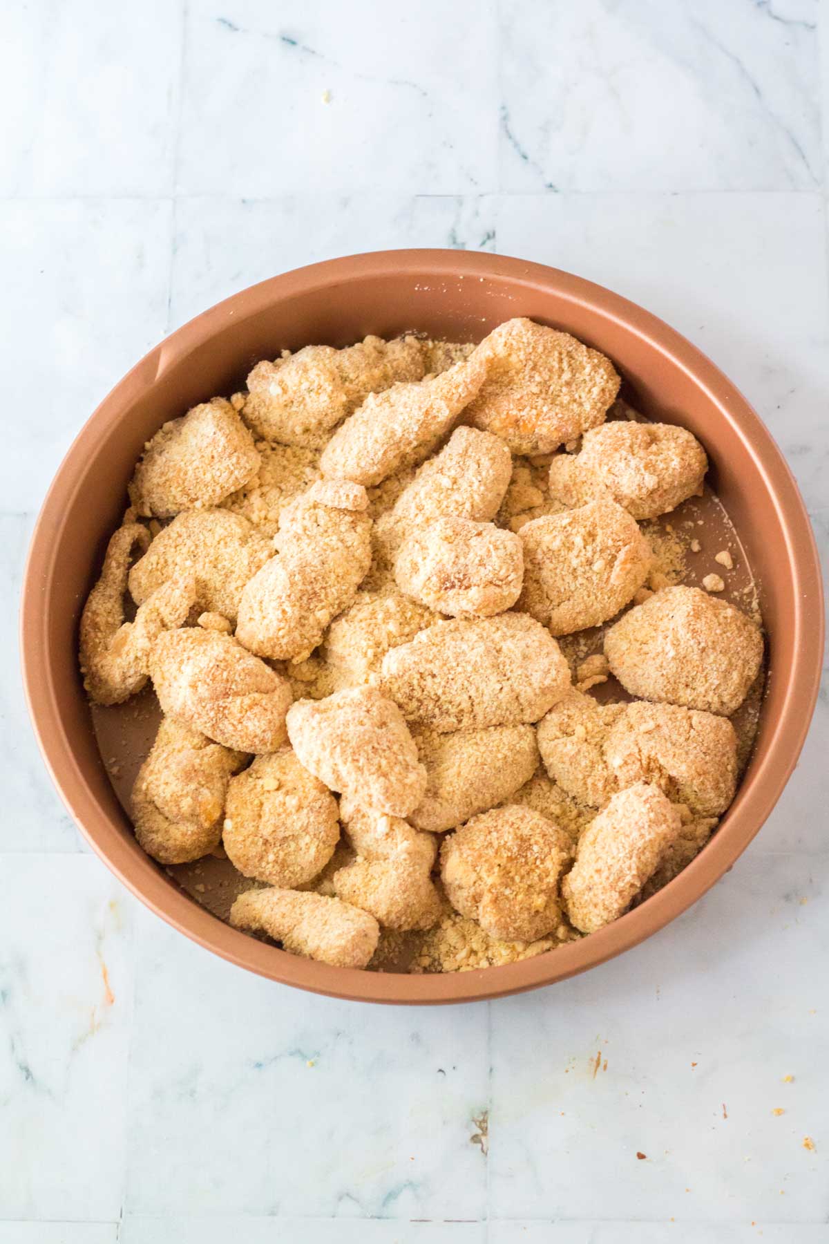 frying copycat chick fil a chicken nuggets in a pan