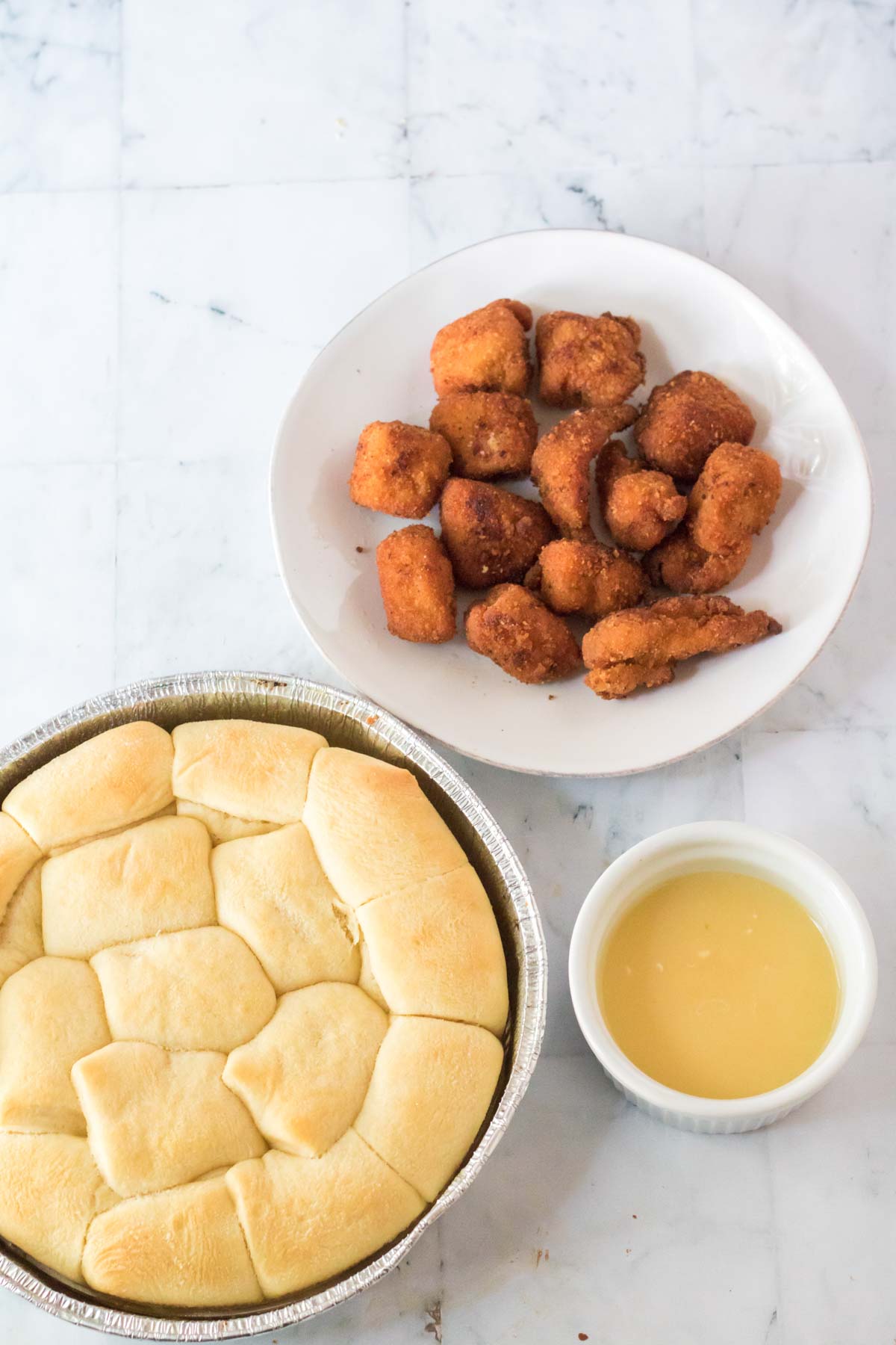 chicken nuggets and rolls on plates