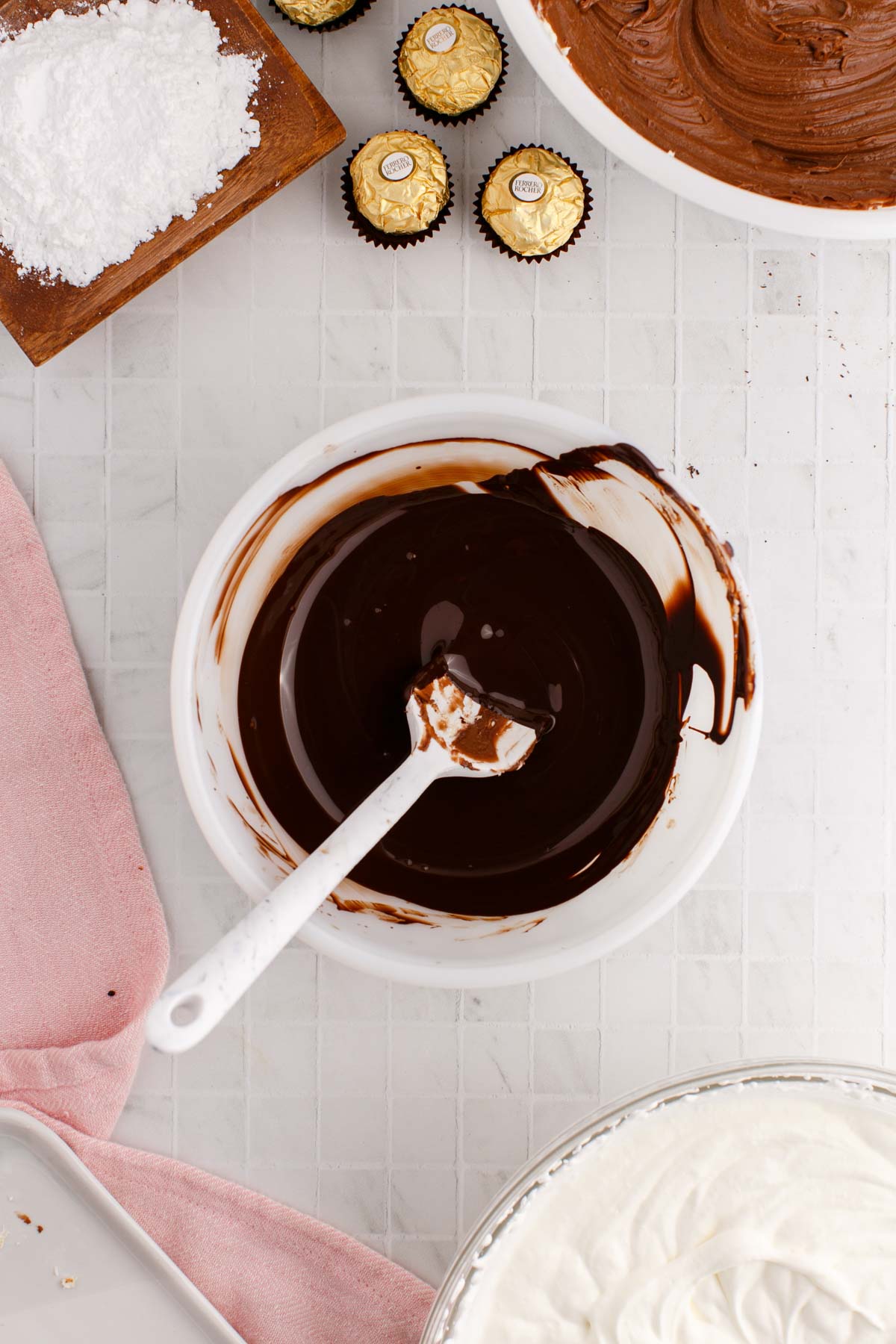melted dark chocolate in a white bowl