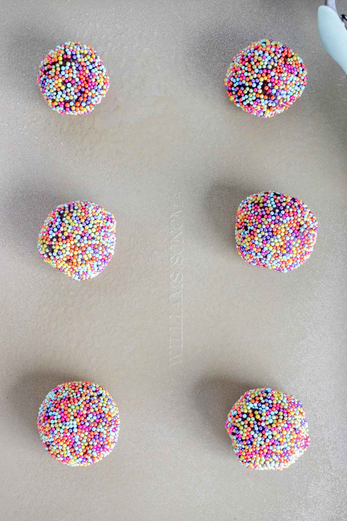 chocolate sprinkle cookies on a baking sheet