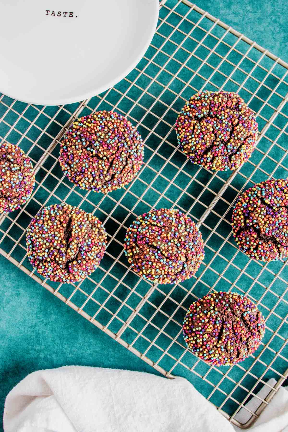 baked chocolate sprinkle cookies on a cookie sheet