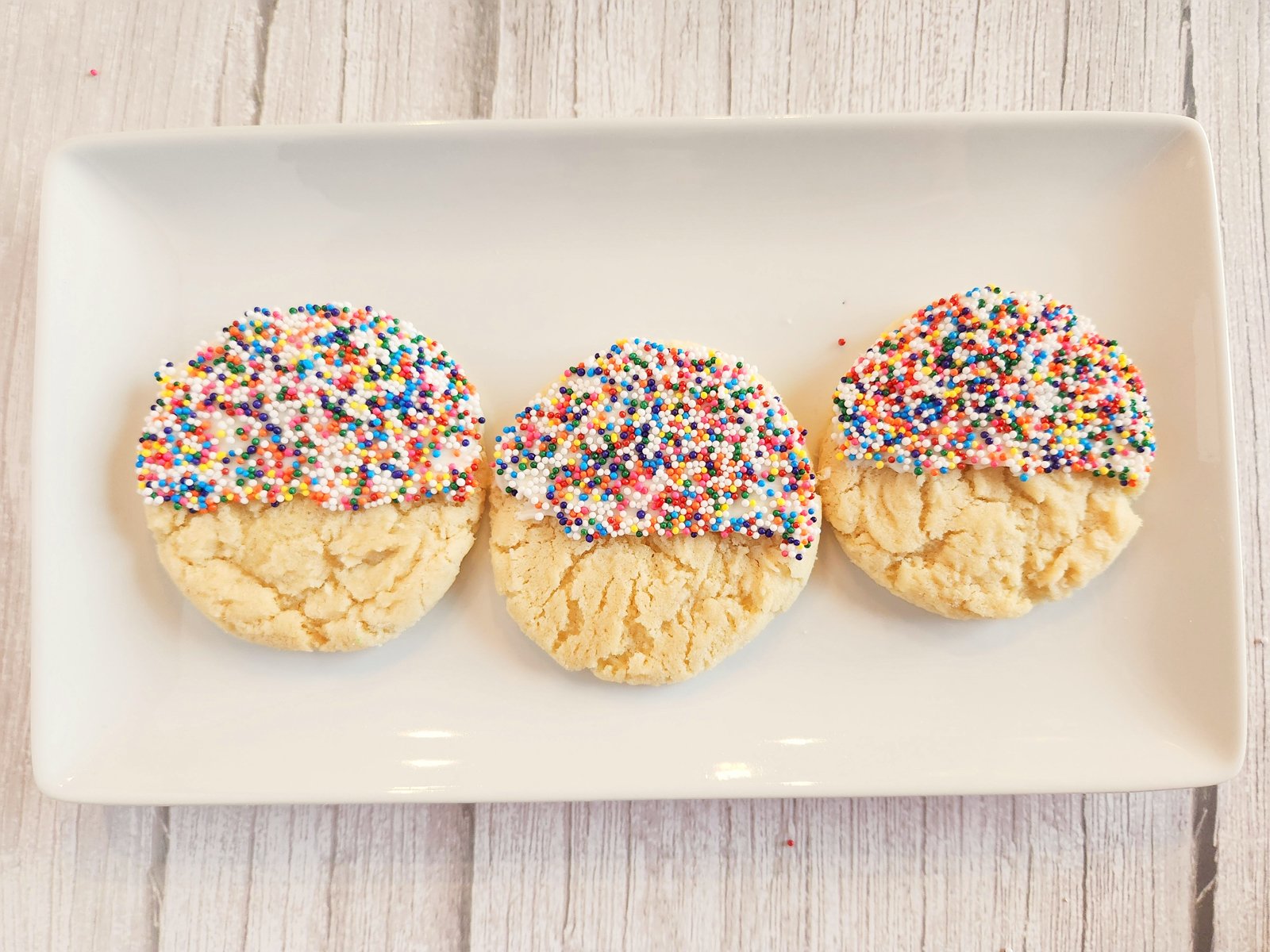 white plate with sprinkle cookies