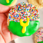 hand holding a football stadium cookie