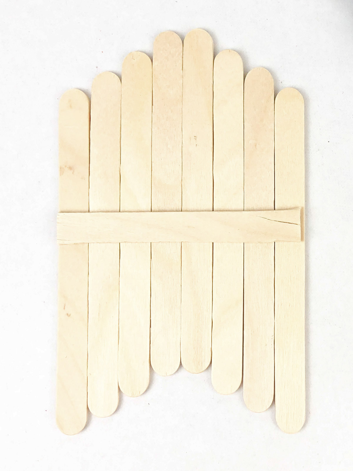 popsicle sticks lined up with one on the back