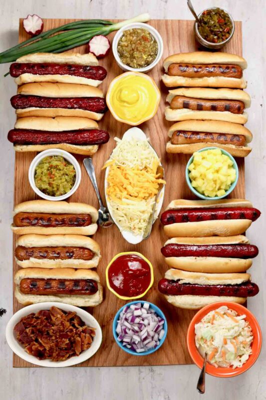 tray of hot dogs and toppings
